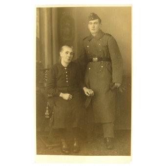 Studio photo, Wehrmacht soldier in overcoat with mother. Espenlaub militaria